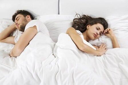 A man with weak potential and a frustrated woman in bed